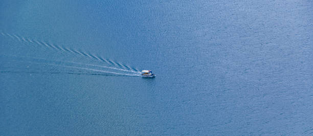 istock Boat Crossing Ocean Aerial View 1349989786