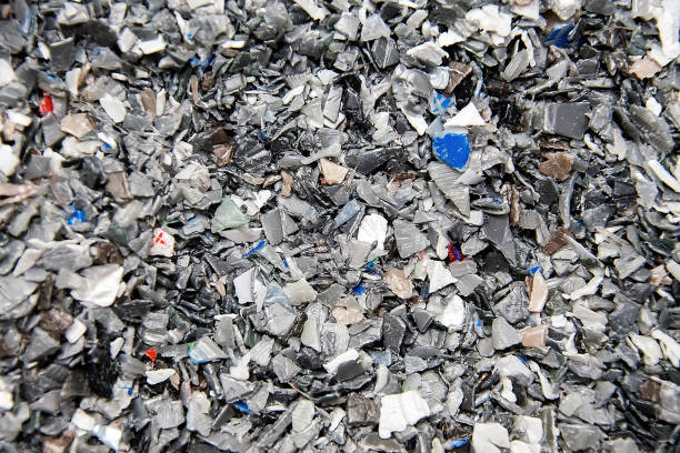 istock Background of plastic polymer flakes for recycling. 1349990468