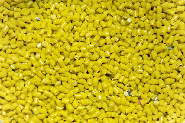 istock Plastic polymer yellow granules for recycling. 1349990470