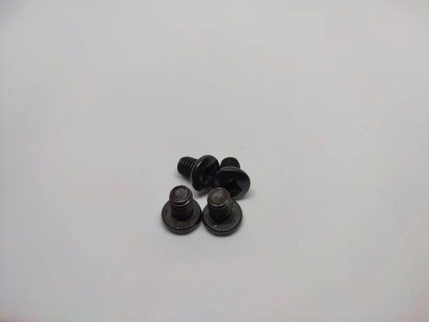 istock Closeup view of screws on a plain white surface 1349992423