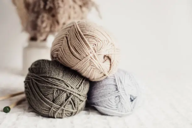 Photo of Craft hobby background with yarn in natural colors. Recomforting, destressing hobby