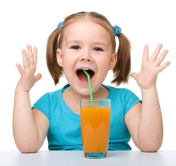 istock Little girl with orange juice 134999524