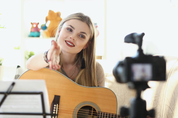 istock Cute musician filming musical clip 1349995450