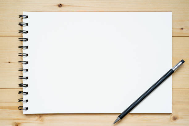 istock A sketchbook and a pen. 1350001128