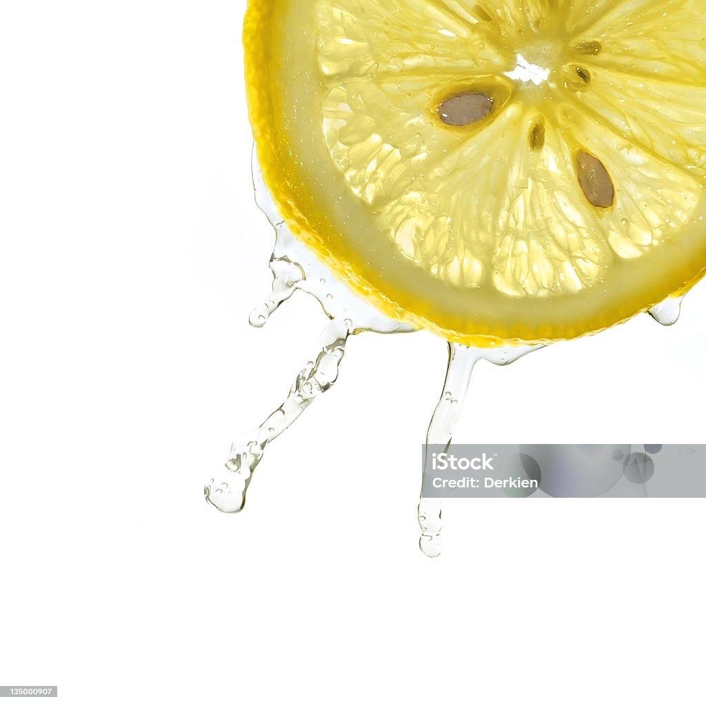 Slice of lemon in water splash Slice of lemon in water splash, closeup, isolated, white background Lemon Juice Stock Photo