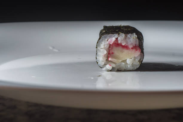 istock Kani sushi on a white plate with dark background 1350010330