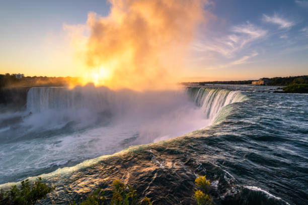 istock Vibrant sunrise illuminating the mist over Niagara Falls 1350010359