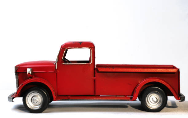 istock Decorative red tin truck at side view 1350011750