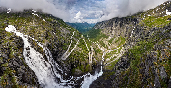 Trollstigen is a serpentine mountain road and pass in Rauma Municipality, Møre og Romsdal county, Norway. It is part of Norwegian County Road 63 that connects the town of Åndalsnes in Rauma and the village of Valldal in Norddal Municipality.