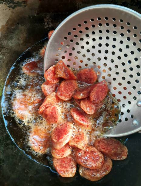 istock Frying Chinese Sausage in cooking pan. 1350017140
