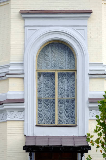 istock Window with vintage white curtain in Kyiv Ukraine 1350018362