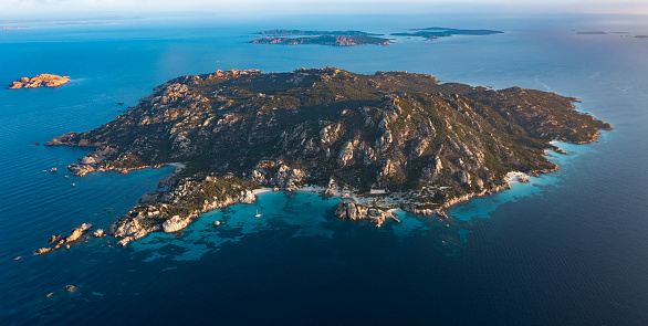 View from above, aerial shot, stunning panoramic view of Spargi Island with Cala Soraya, a white sand beach bathed by a turquoise water. La Maddalena archipelago National Park, Sardinia, Italy.