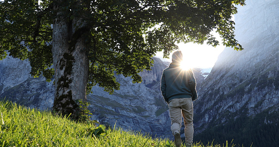 He looks off towards the European Alps in the distance