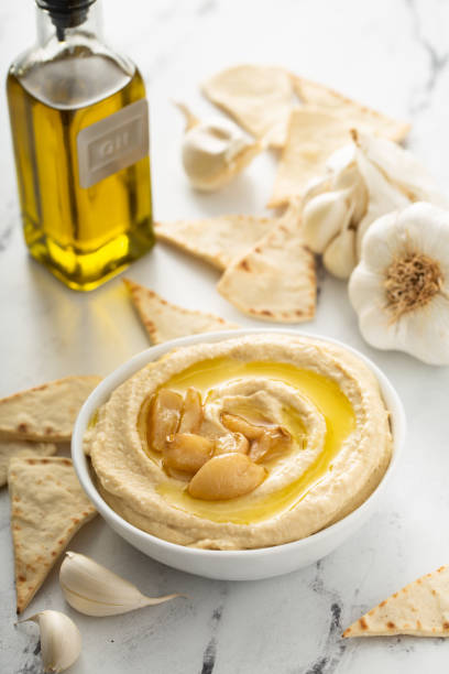 istock Roasted garlic hummus topped with olive oil 1350023949