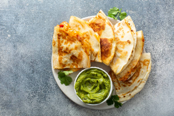 istock Shrimp and cheese quesadillas served with guacamole 1350024019