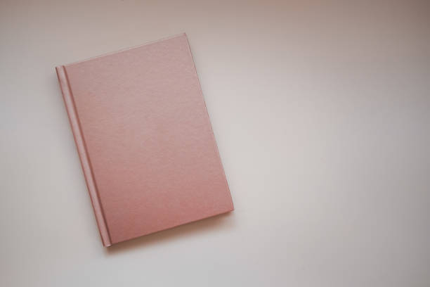 istock Closed notebooks copper color. Top view 1350024180