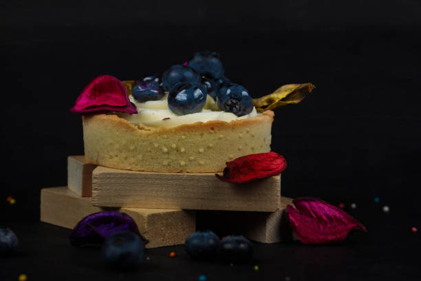istock A beautiful cake with blueberries on a dark wooden background. 1350024357