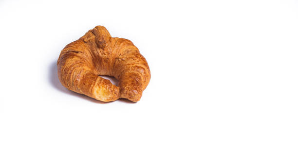 istock butter croissant, ribbon type, fresh on white background, and copy space. 1350025299