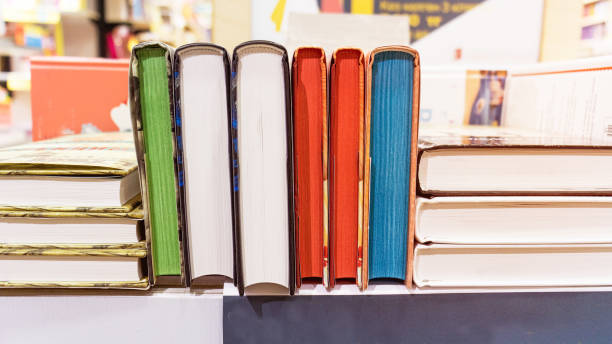 istock shelf for books. Multi-colored books. Book store. Library. 1350025340