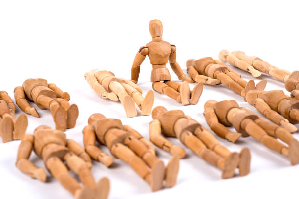istock Wooden mannequin sleeping in a group and one woke up 1350025453