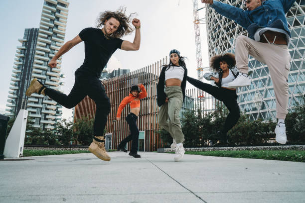 istock Five cool friends are jumping in a modern location 1350027361