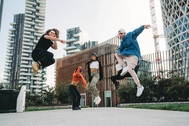 istock Five cool friends are jumping in a modern location 1350027365