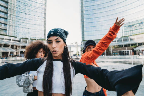 istock Three female dancer friends are posing in a modern city 1350027392
