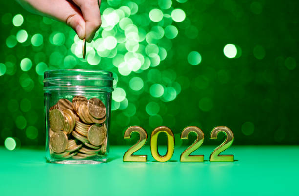 istock 2022 new year and coin jar on the table 1350027772