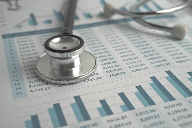 istock Stethoscope on spreadsheet paper, Finance, Account, Statistics, Investment, Analytic research data economy spreadsheet and Business company concept. 1350027804