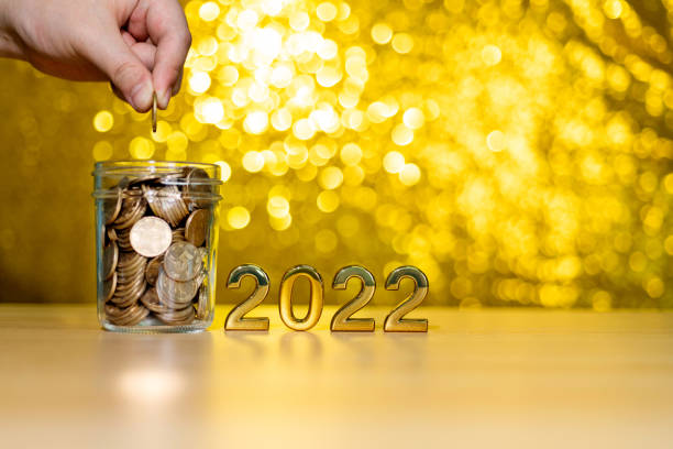 istock 2022 new year and coin jar on the table 1350027882