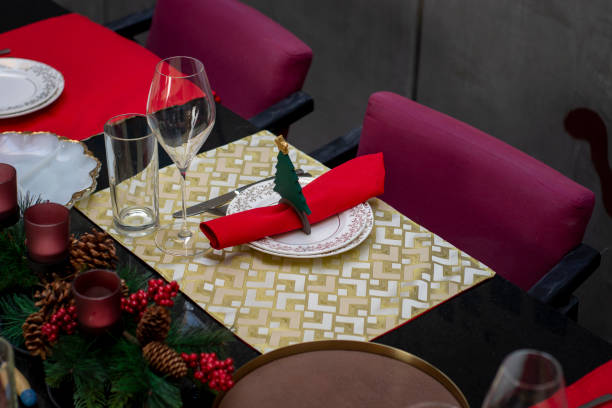 istock Christmas decoration on a table with tablecloths, glassware and crockery for Christmas dinner 1350030765