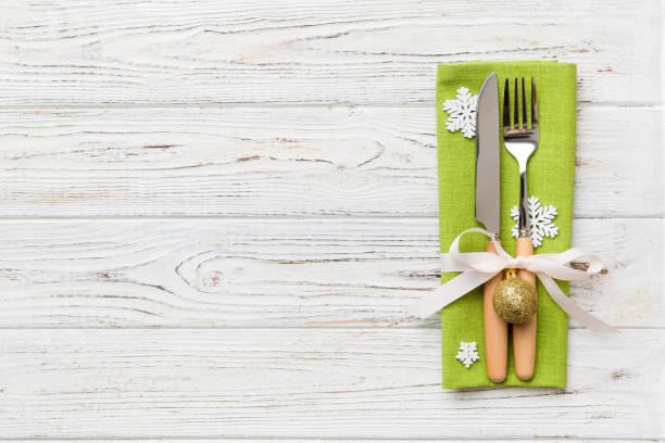 istock Christmas table place setting with knife, napkin and fork. Holidays new year background with copy space 1350032183