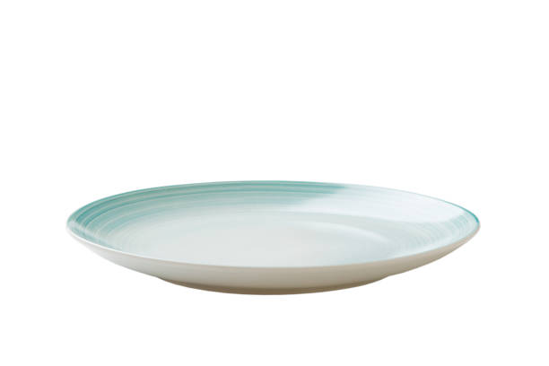 istock Blue ceramic round plate isolated over white background. perspective view 1350032261