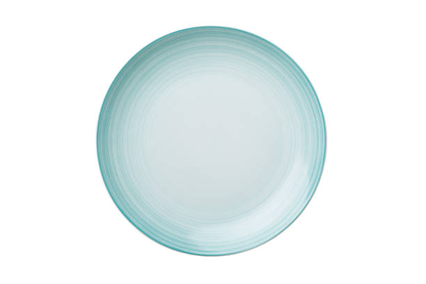 Blue ceramic round plate isolated over white background. Top view