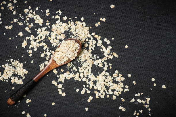 wheat flakes in a wooden spoon