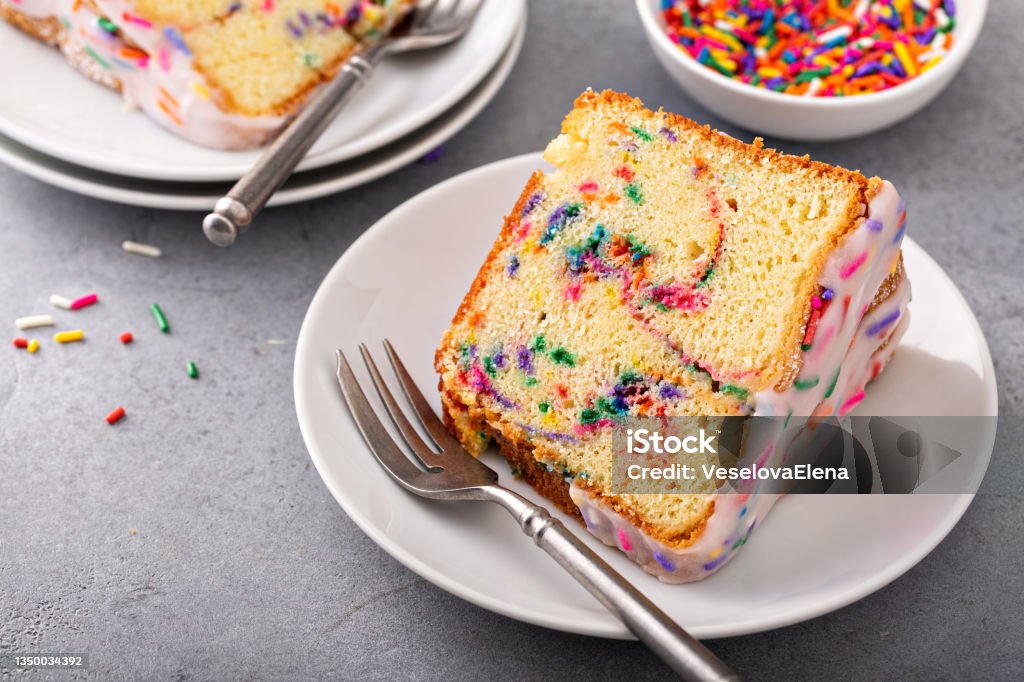 Celebration funfetti birthday pound cake with sprinkles Celebration funfetti pound bundt cake with sprinkles and sugar glaze Cake Stock Photo