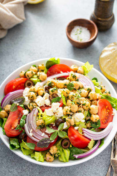 istock Healthy spring Greek salad with fresh vegetables and chickpeas 1350034428