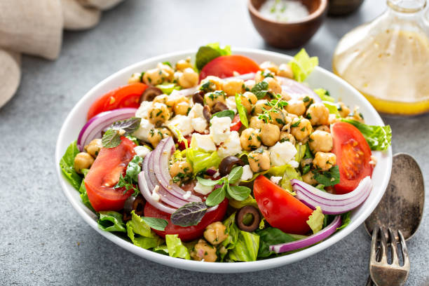 istock Healthy spring Greek salad with fresh vegetables and chickpeas 1350034429