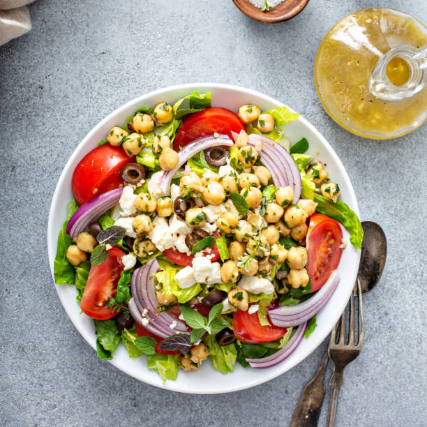 istock Healthy spring Greek salad with fresh vegetables and chickpeas 1350034431