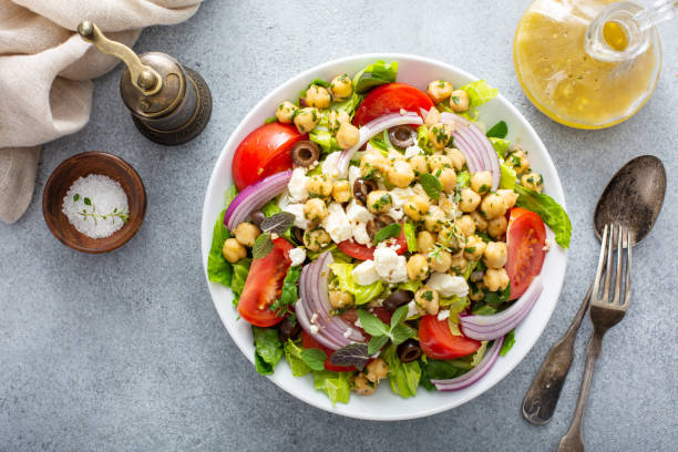 istock Healthy spring Greek salad with fresh vegetables and chickpeas 1350034433
