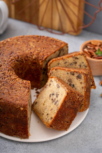 istock Traditional brown sugar pecan cake, bundt pan 1350034445