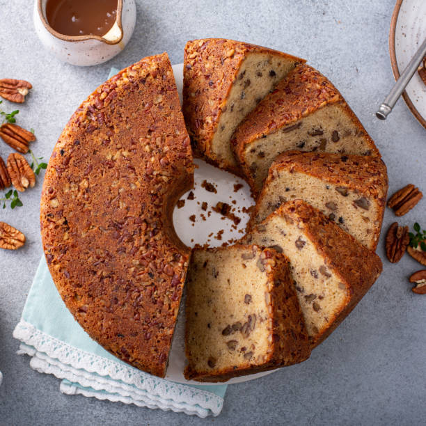 istock Traditional brown sugar pecan cake, bundt pan 1350034457