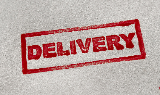 Delivery stamp on white background.