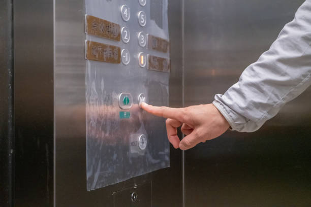 istock One hand in the elevator is ready to press the button to close the door 1350035512
