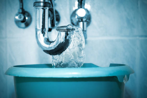 istock Plumber flushes the drain pipe in the bathroom 1350036510