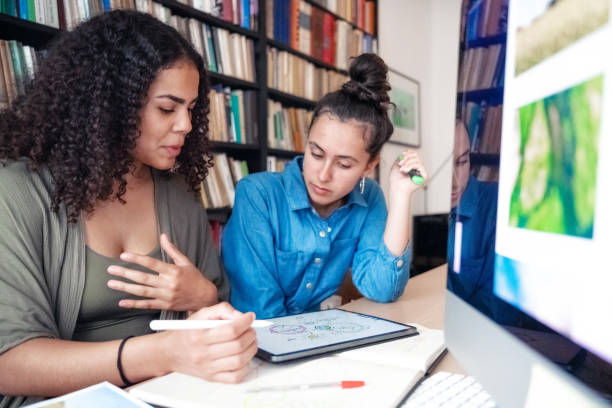 istock two young woman preparing together presentation for climate protection 1350038185