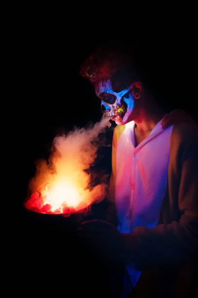 istock Young man dressed for Halloween exhaling smoke 1350041424
