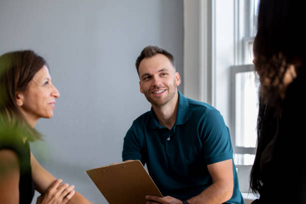 istock Diverse group of people in meeting or support group 1350041620