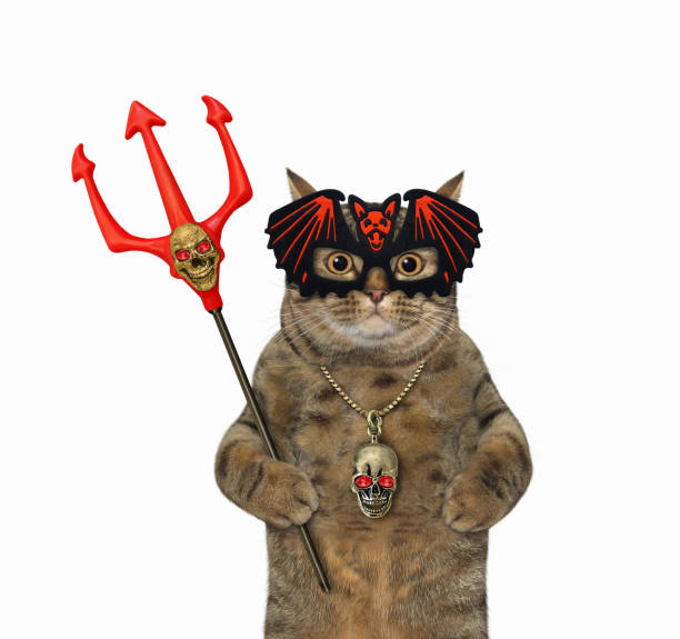 istock Cat in bat mask holds trident 1350050053