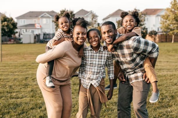 istock Family with three kids looking at camera 1350050614
